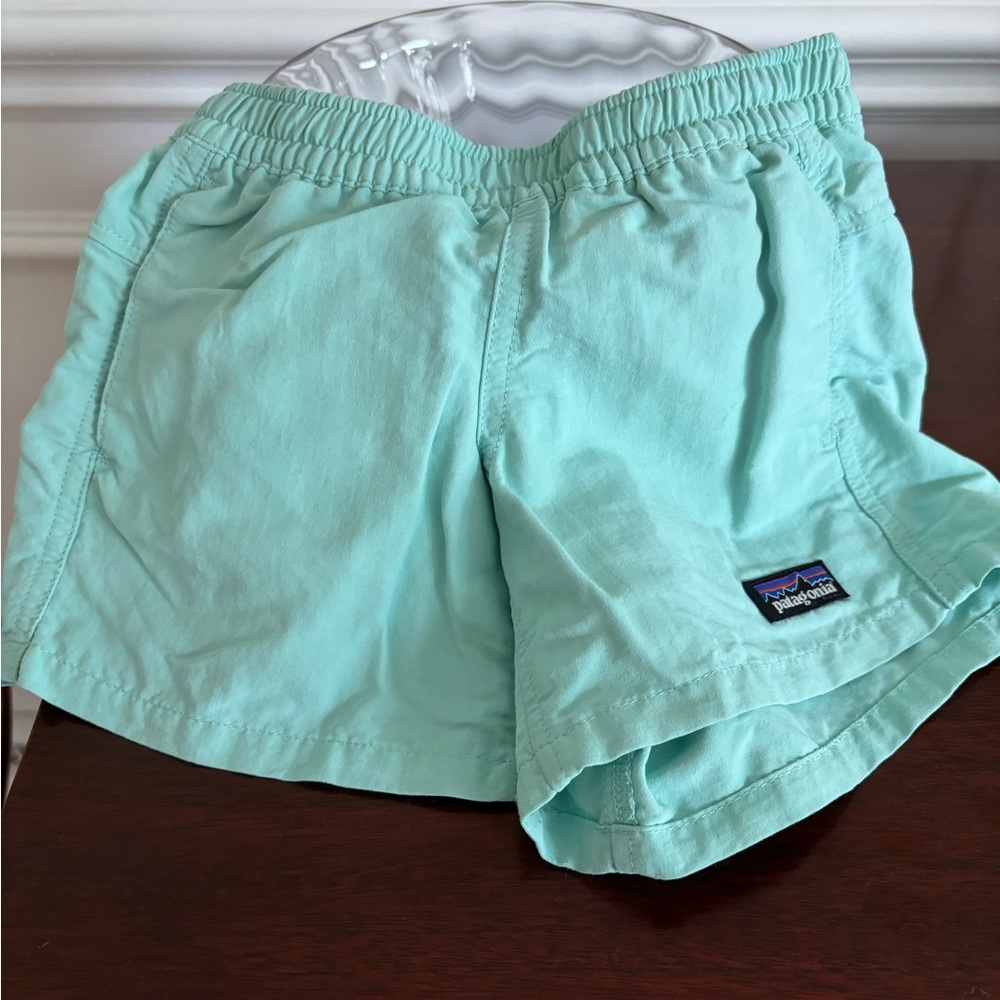 Patagonia quick dry turquoise/sea green shorts, fits a 4-5 year old girl well!